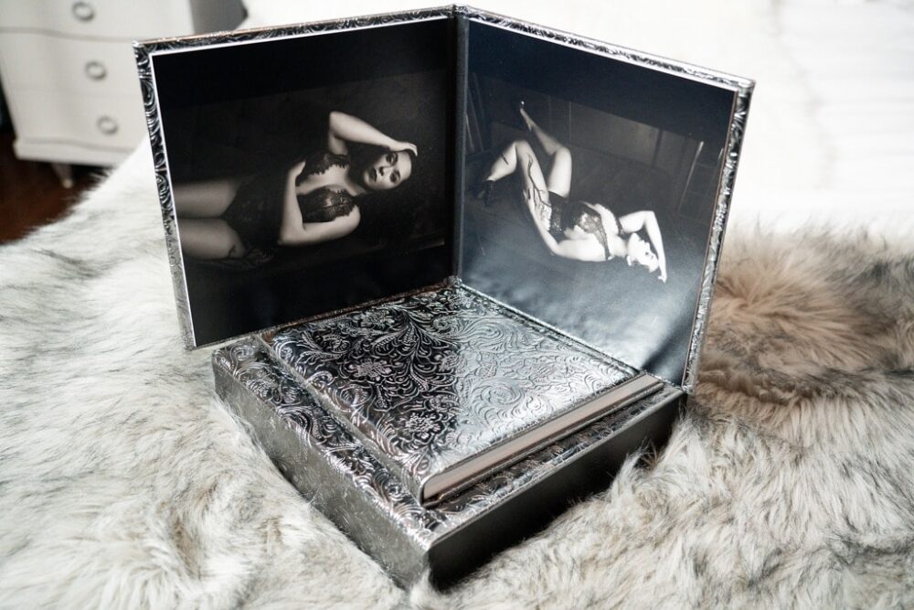 A black and silver box with a photo of a woman, captured through Northern Virginia Boudoir Photography.
