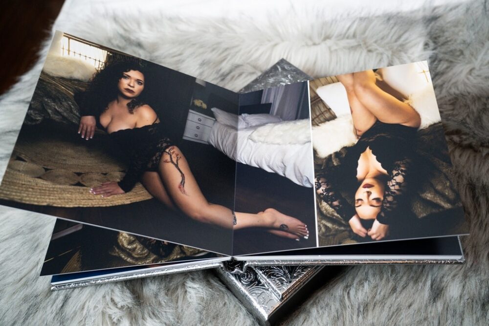 custom designed lay flat boudoir album with two images of woman posing in boudoir studio wearing lingerie